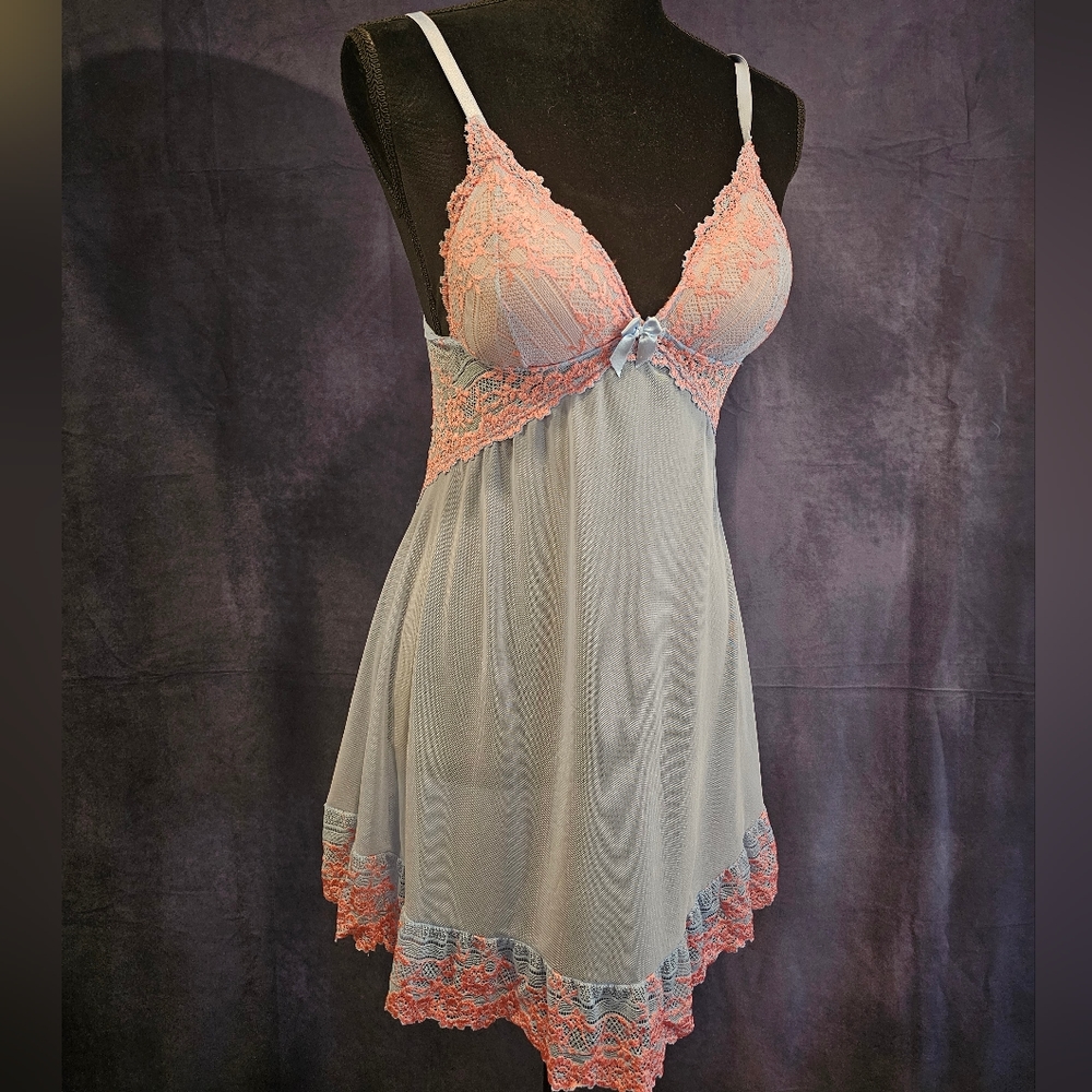 Sexy blue nylon lingerie with matching bust and pink lace ruffle.  Size S